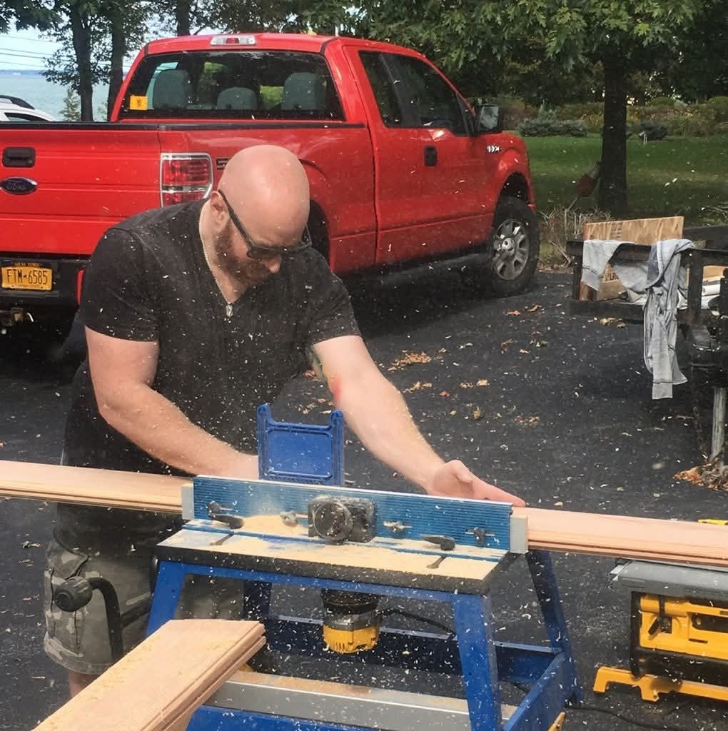 Jon-Michael Passerino, master craftsman and founder of Bespoke Customs, at work on custom millwork in Northern New York
